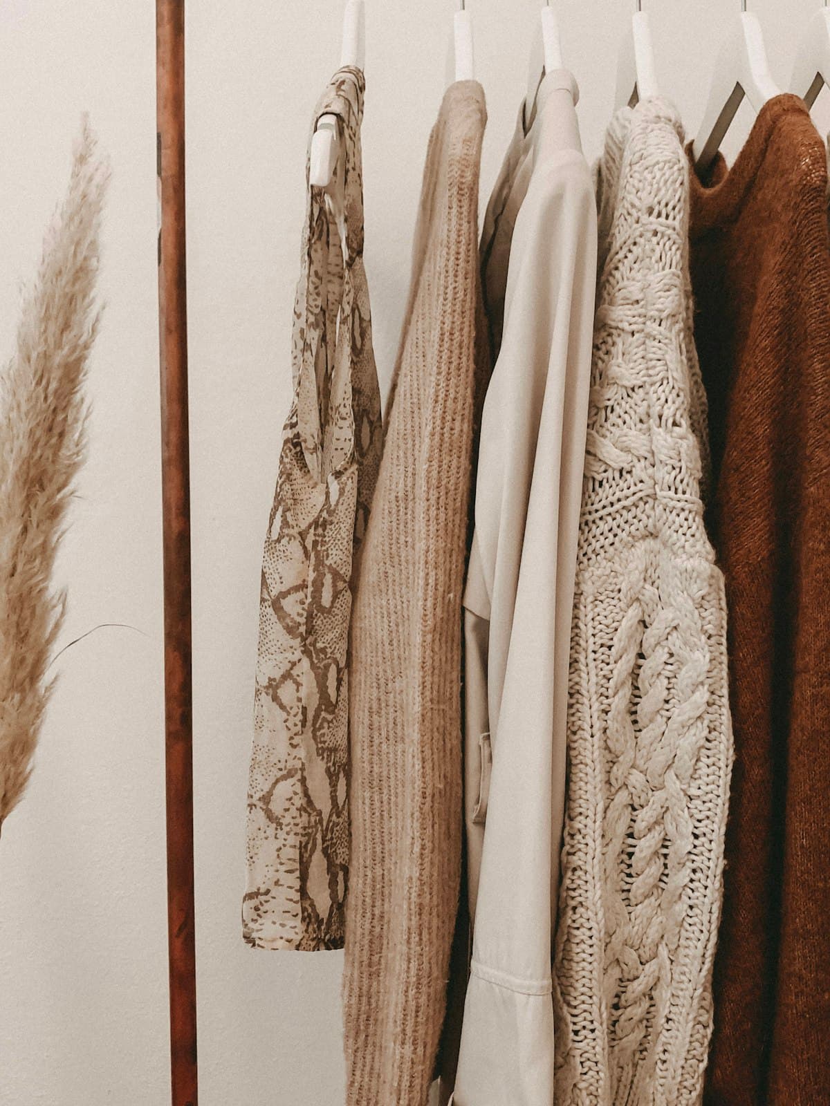Curated thrift finds on a clothing rail
